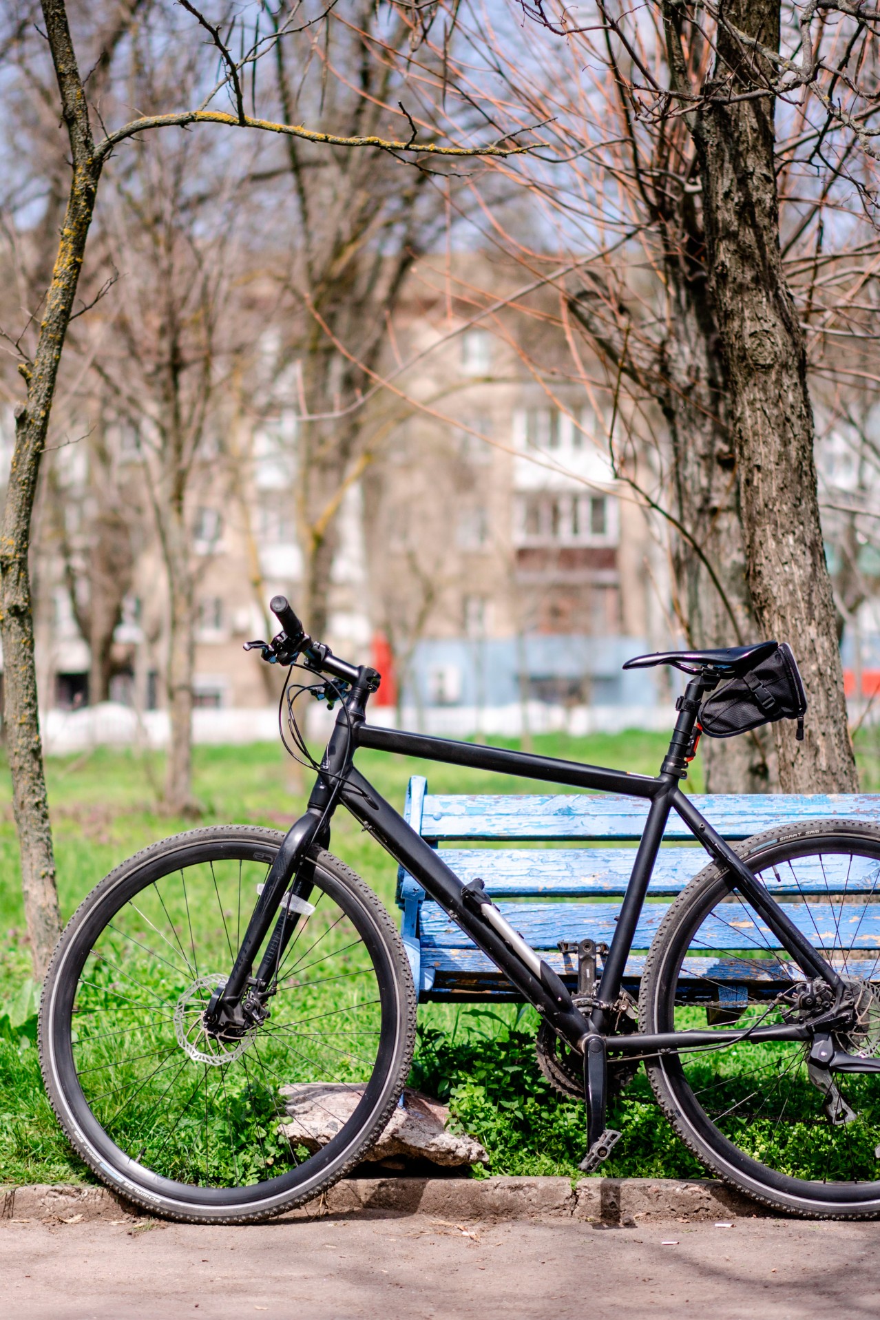 Bike near the wooden bench in park