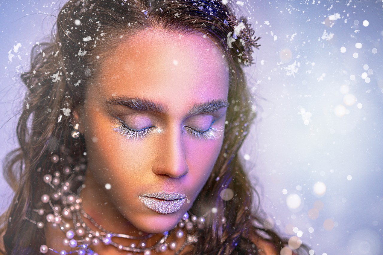Close-up view of winter girl with trendy makeup