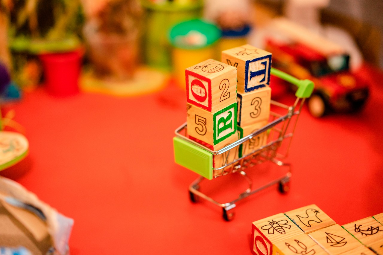 Educational cubes in the toy shopping cart