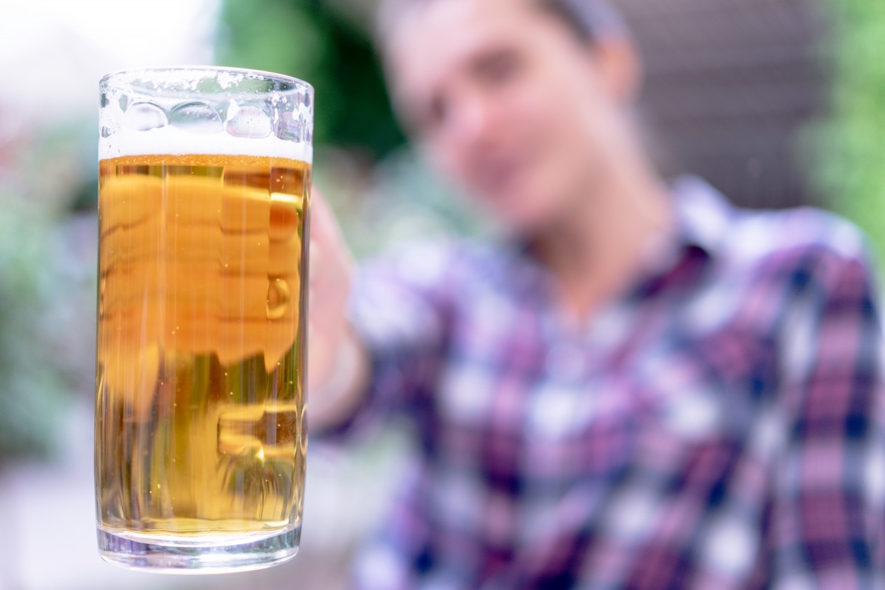 Glass of a light beer on blurry background