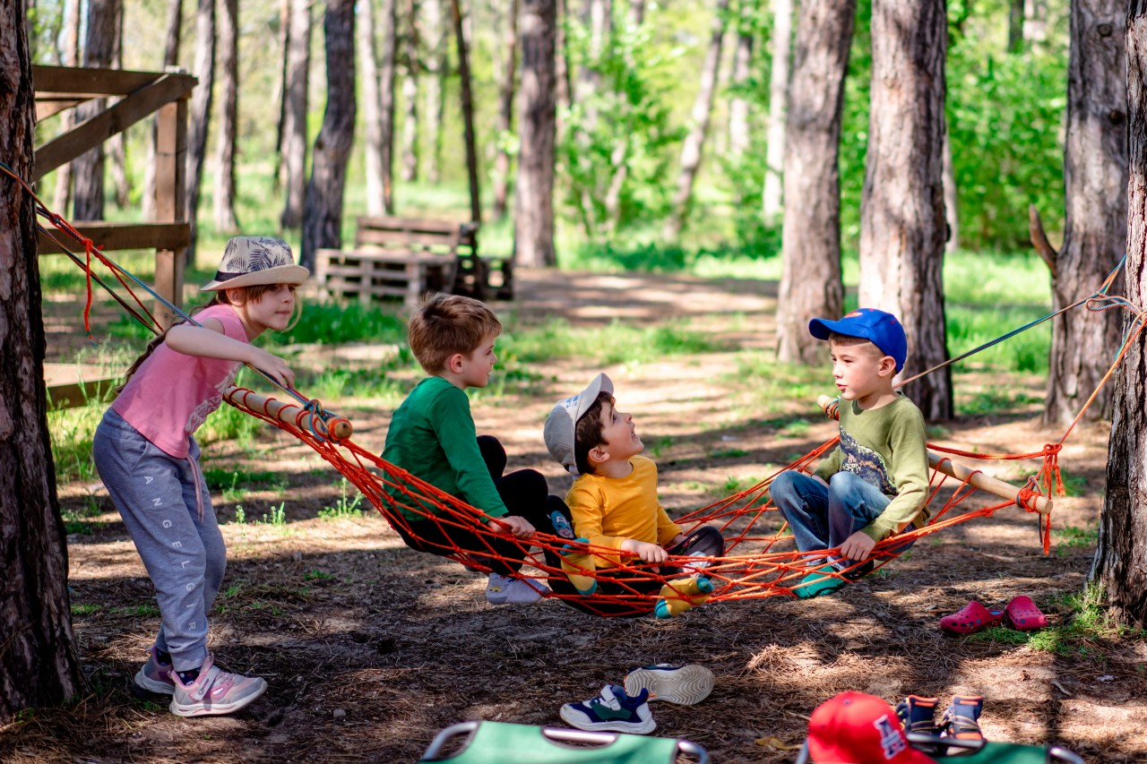 Kids in the hammock in the forest