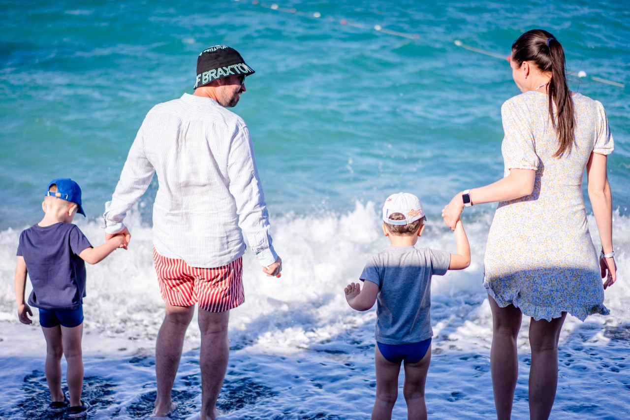 Family with kids at the sea