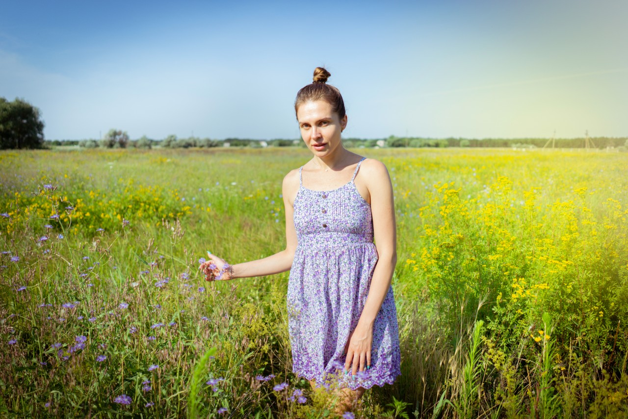 Pretty Young Woman in Summer Sundress on a Ranch 