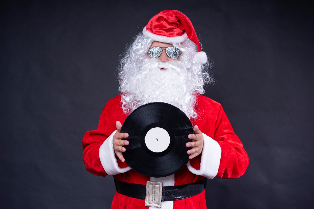 Santa Claus holding vinyl record