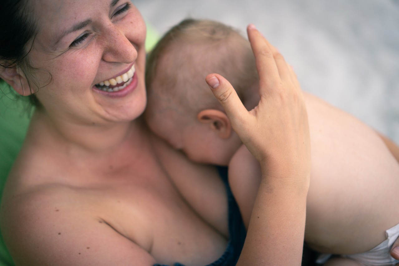Laughing woman with her toddler