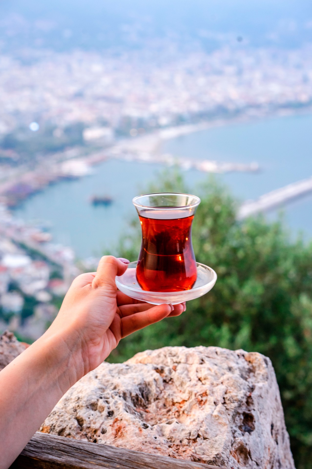 Woman holding glass of Turkish tea