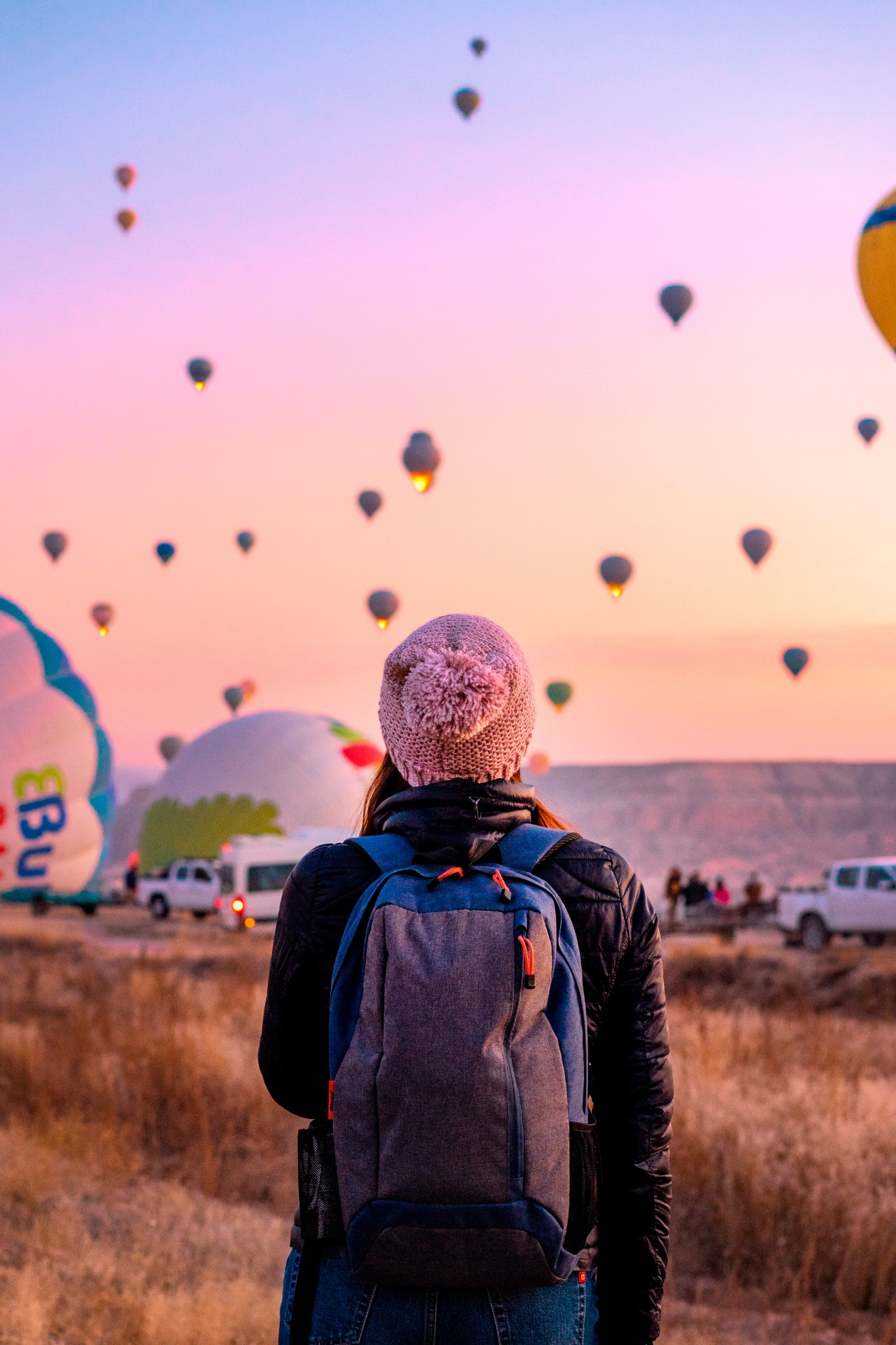 A Young Girl Looks at Balloons in Cappadocia
