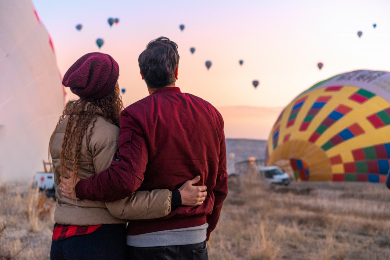 Young Couple on the Background of Balloons in Cappadocia