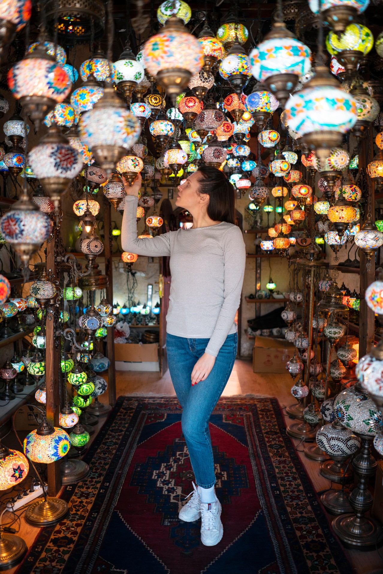 Woman looks at the Turkish lanterns