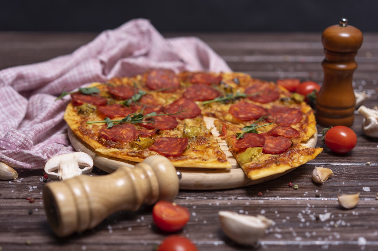 Italian Pizza on Wooden Background
