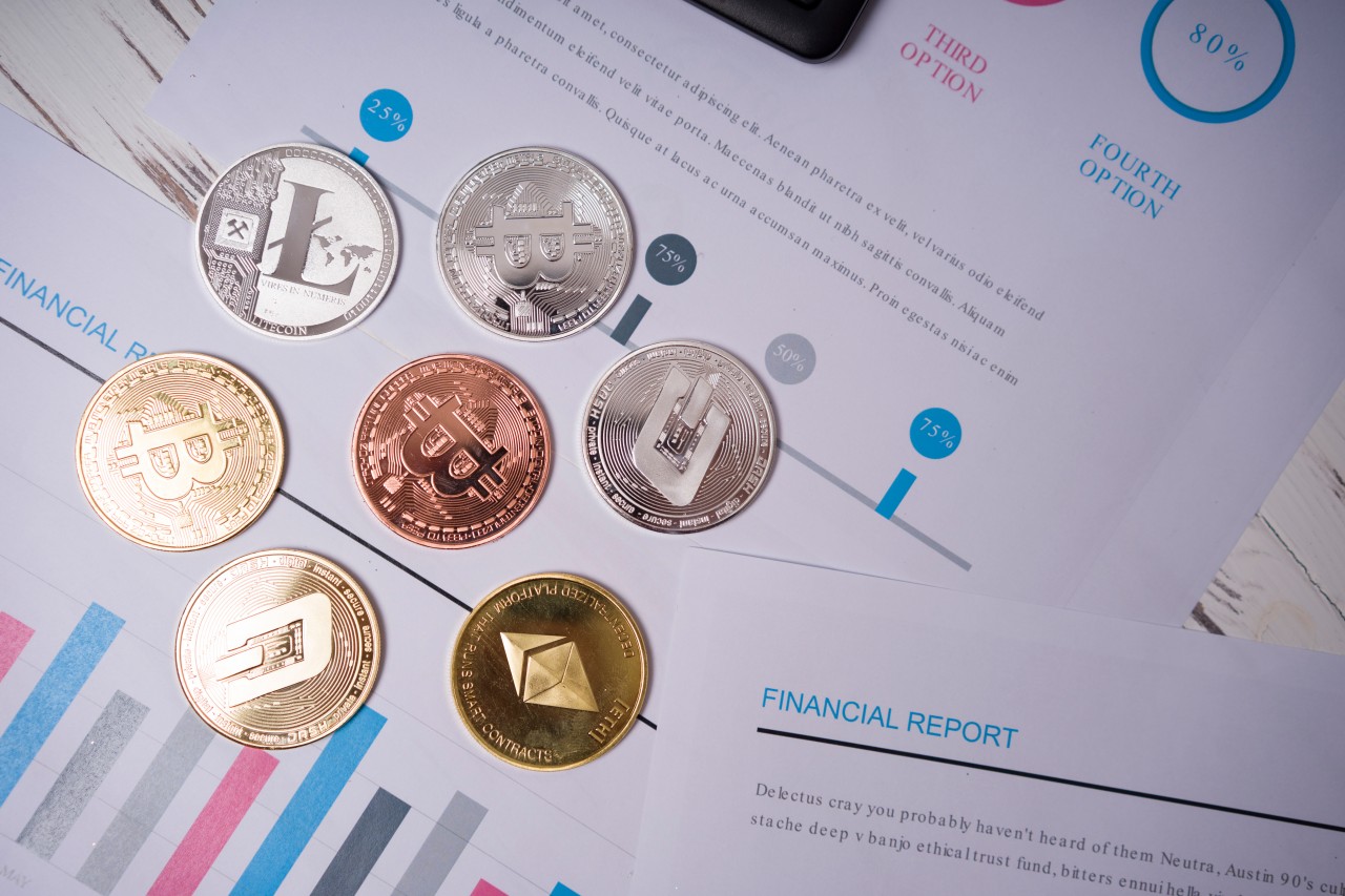 Flat lay with bitcoins and business documents