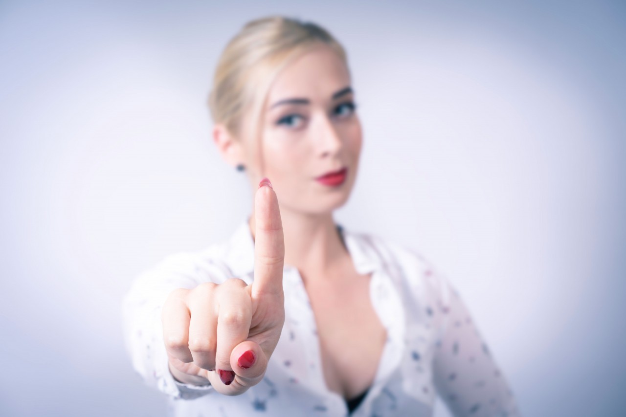 Young Blond Woman in White Shirt with Gestures