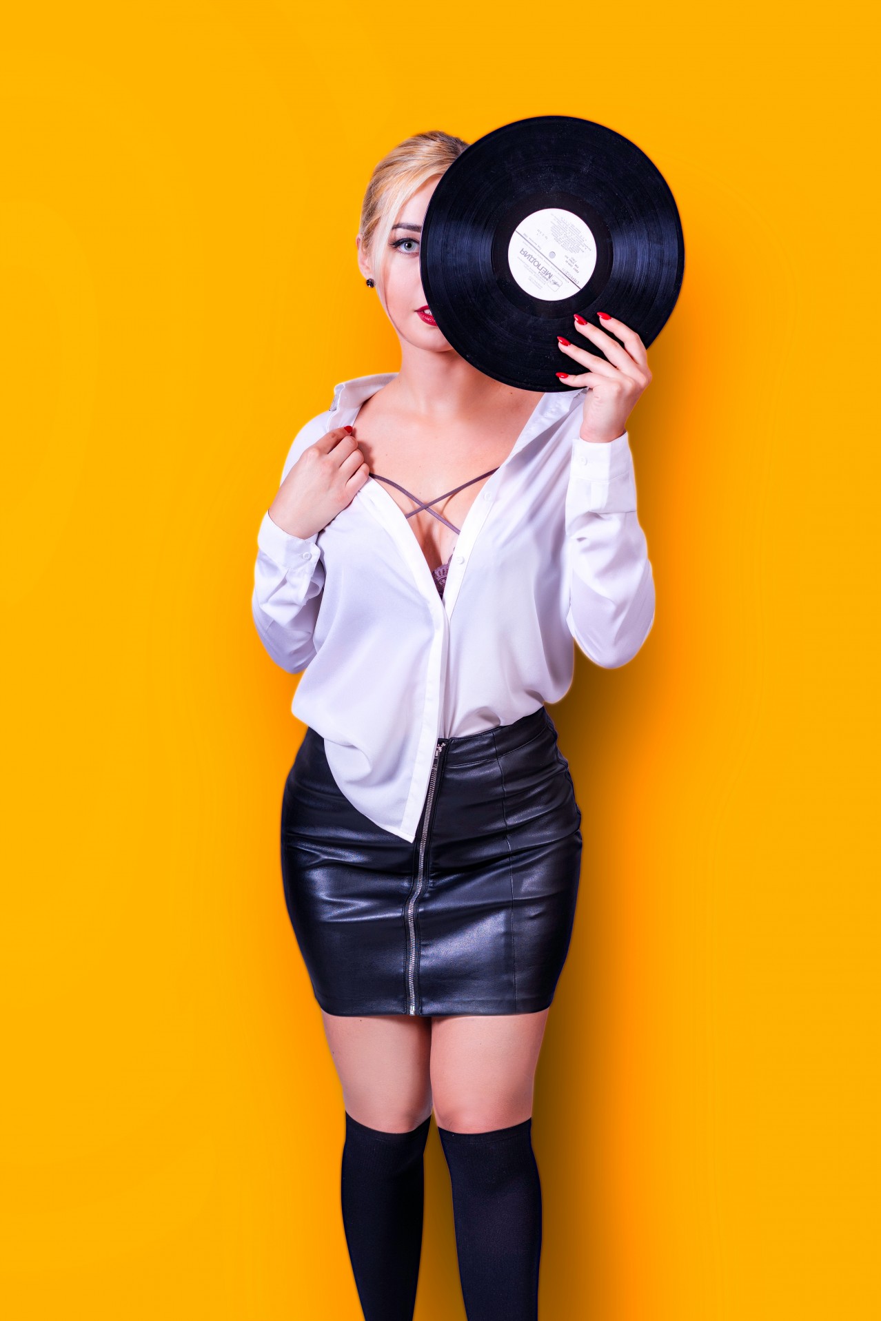 Hot girl holding retro vinyl record
