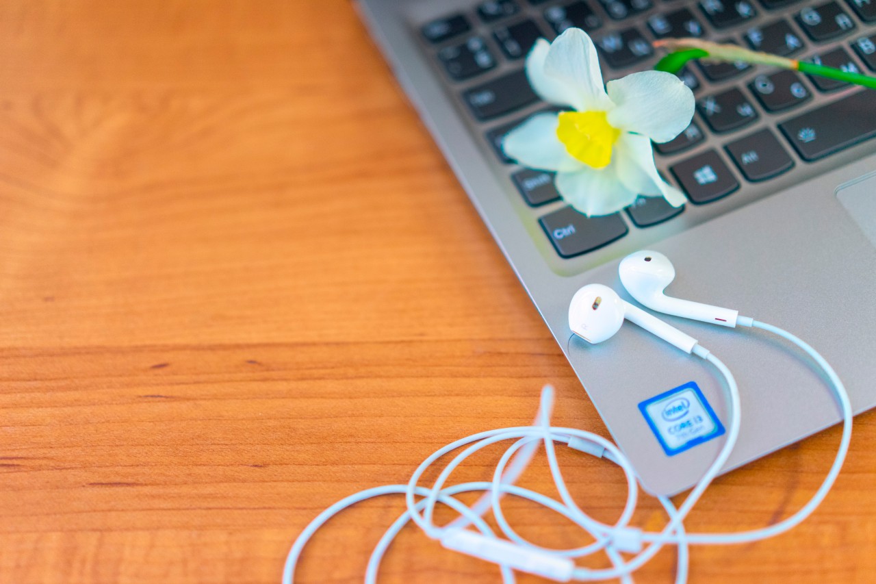 Laptop with flower and earphones