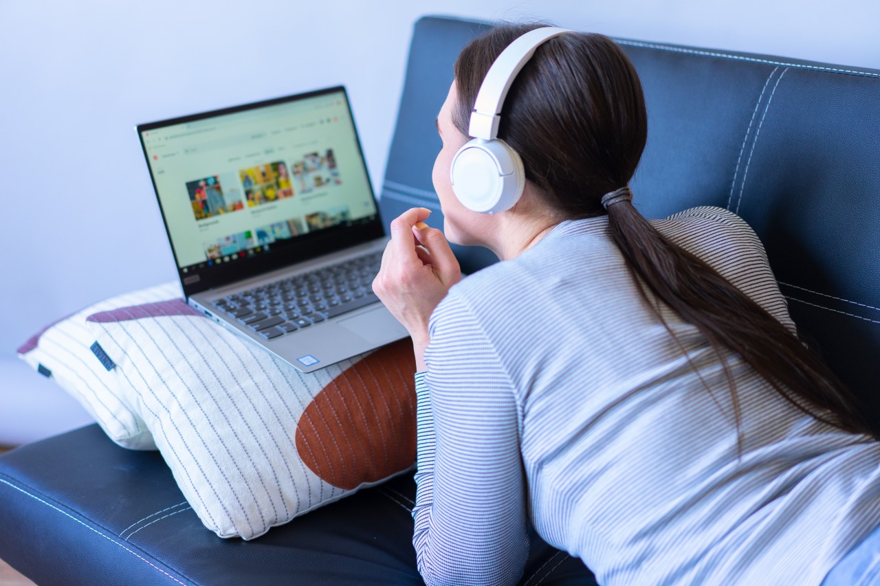 Young Girl with a Laptop and Headphones
