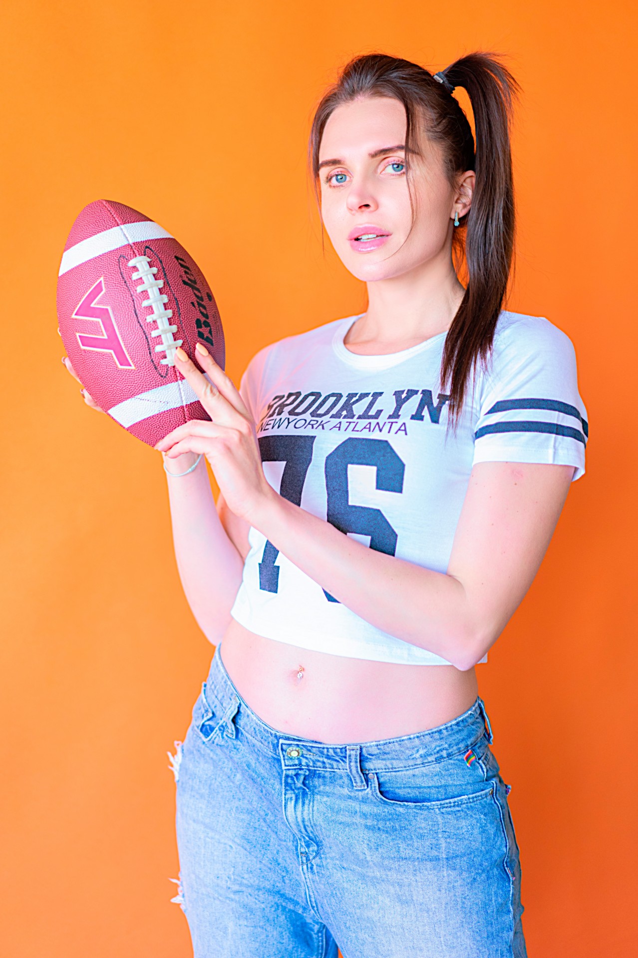 Sexy girl with a football ball