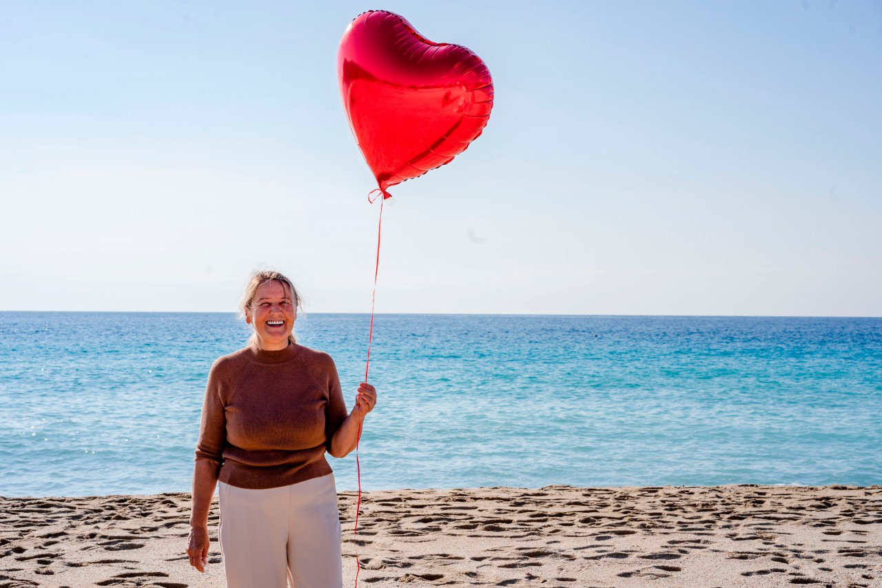 Woman with a Heart-shaped Balloon in Her Hand