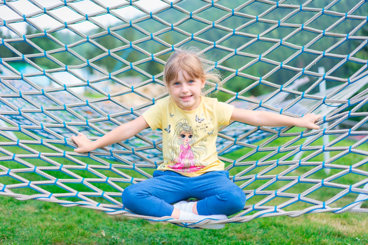Smiling little girl in the hammock