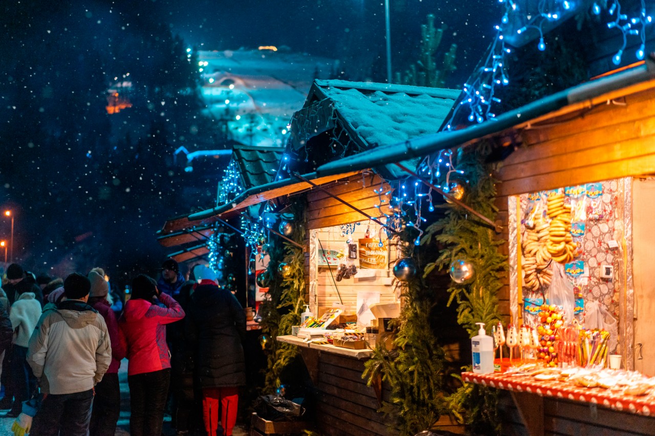 Outdoor Christmas market on a snowy night