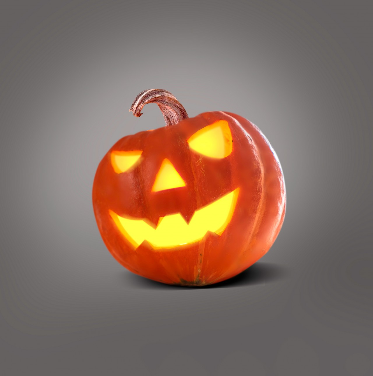 Scary Halloween pumpkin on grey background