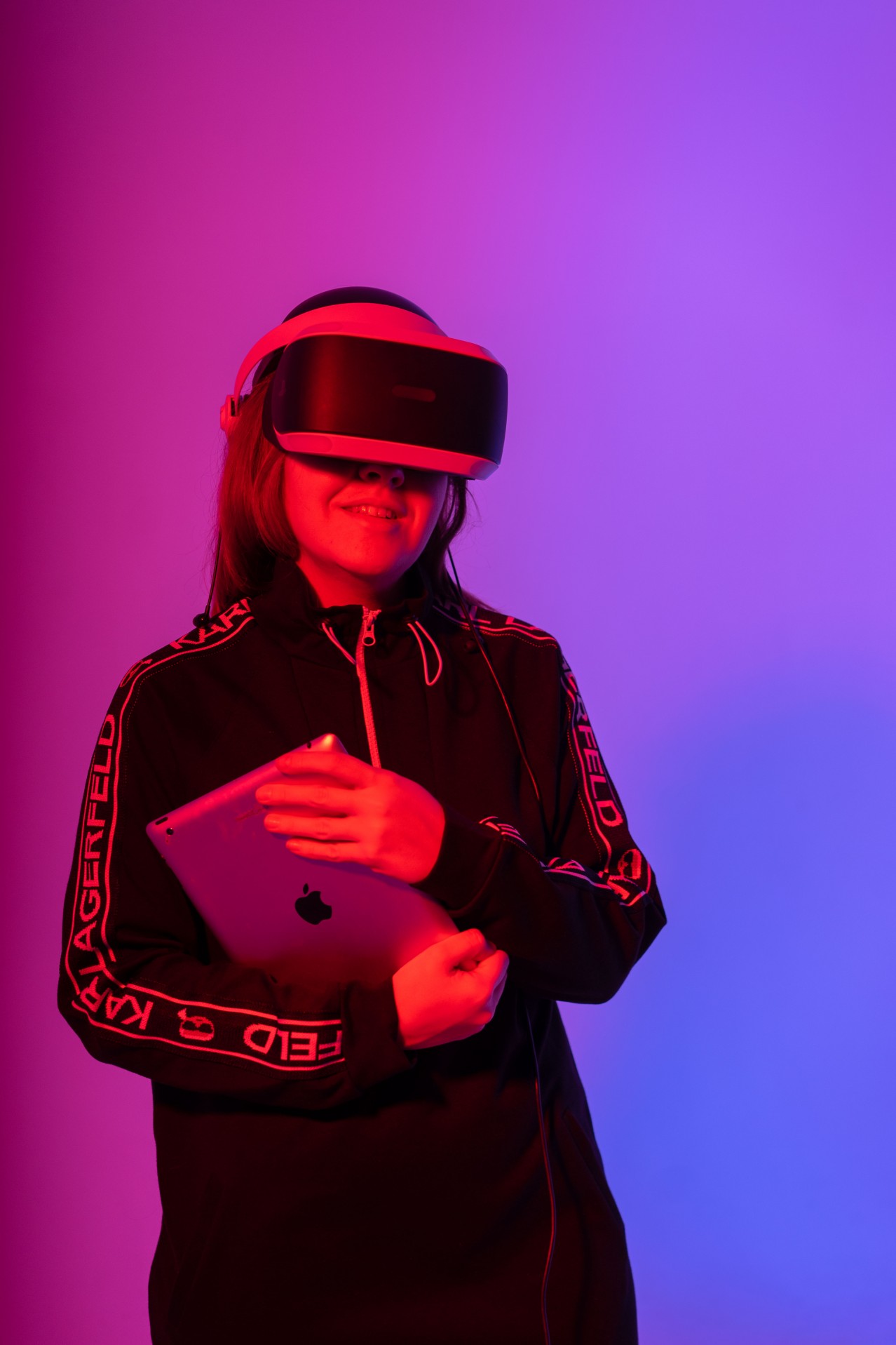 Girl with VR Glasses and a Tablet in Her Hand